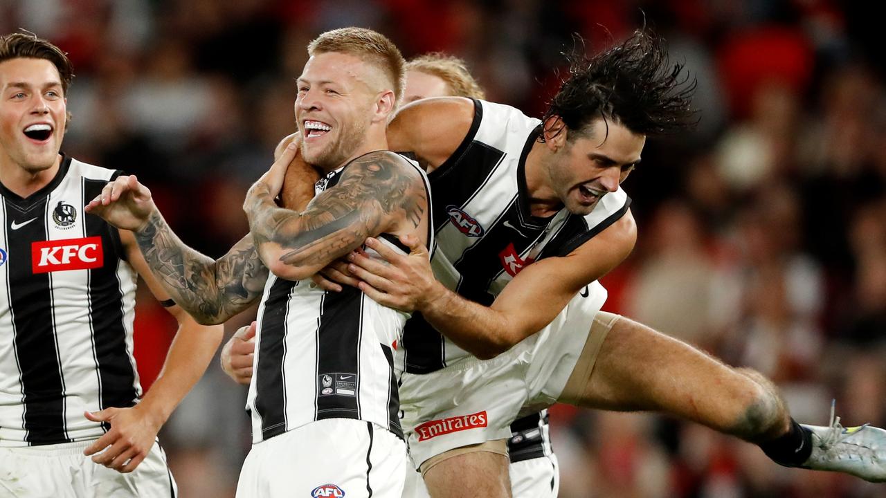 Jordan De Goey of the Magpies celebrates a goal with Brodie Grundy in 2022. Picture: Dylan Burns