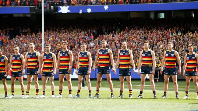 Adelaide players line up for the anthem on Grand Final day.