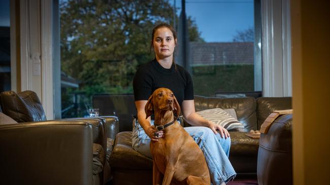 Annabel Thomson and her dog Austin came across two masked intruders, including Bob Jal, in her home. Picture: Jake Nowakowski