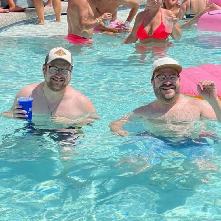 A tourist has gone viral after he posted a picture of the moment he met his doppelganger in a hotel pool online. Picture: Reddit