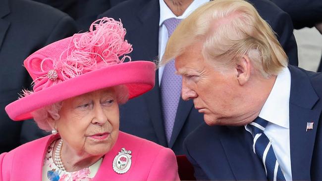 (FILES) In this file photo taken on June 5, 2019 Britain's Queen Elizabeth II (L) reacts as she sits with US President Donald Trump an event to commemorate the 75th anniversary of the D-Day landings, in Portsmouth, southern England. - Queen Elizabeth II, the longest-serving monarch in British history and an icon instantly recognisable to billions of people around the world, has died aged 96, Buckingham Palace said on September 8, 2022. Her eldest son, Charles, 73, succeeds as king immediately, according to centuries of protocol, beginning a new, less certain chapter for the royal family after the queen's record-breaking 70-year reign. (Photo by Chris Jackson / POOL / AFP)