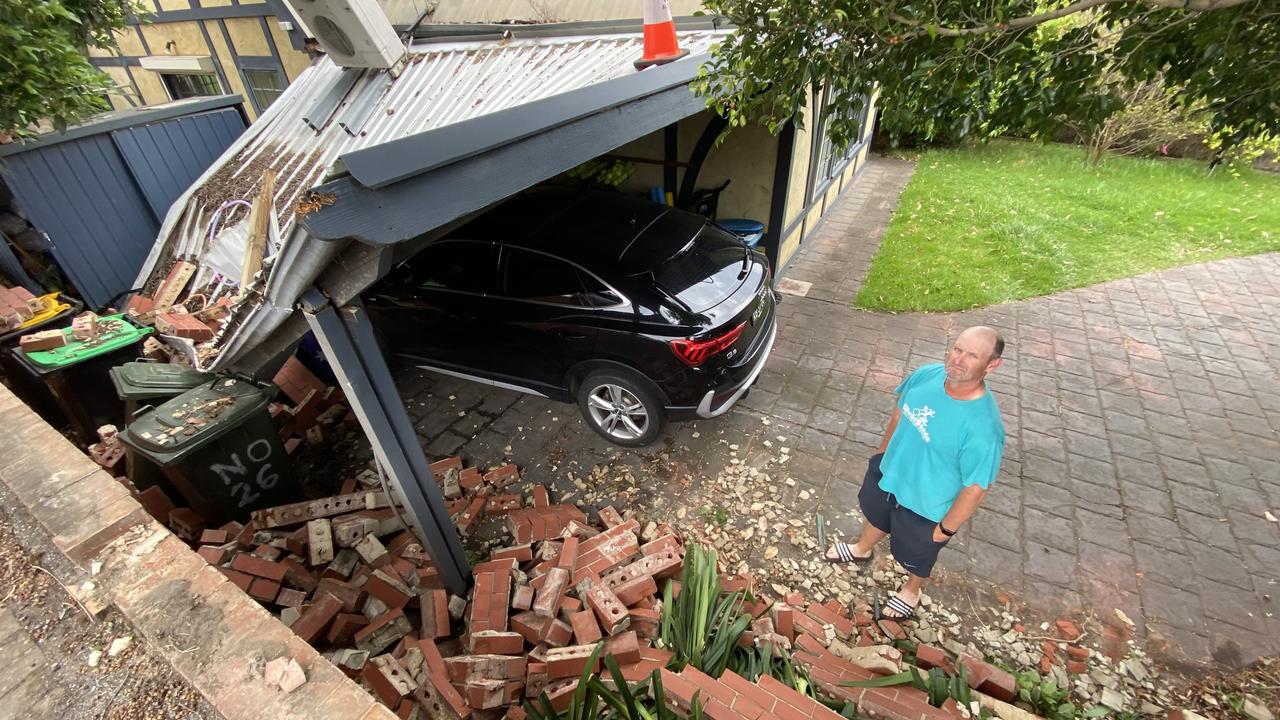 Warren McInnes with his collapsed carport on Portrush Rd after the overnight storm. Picture: Roy Van Der Vegt