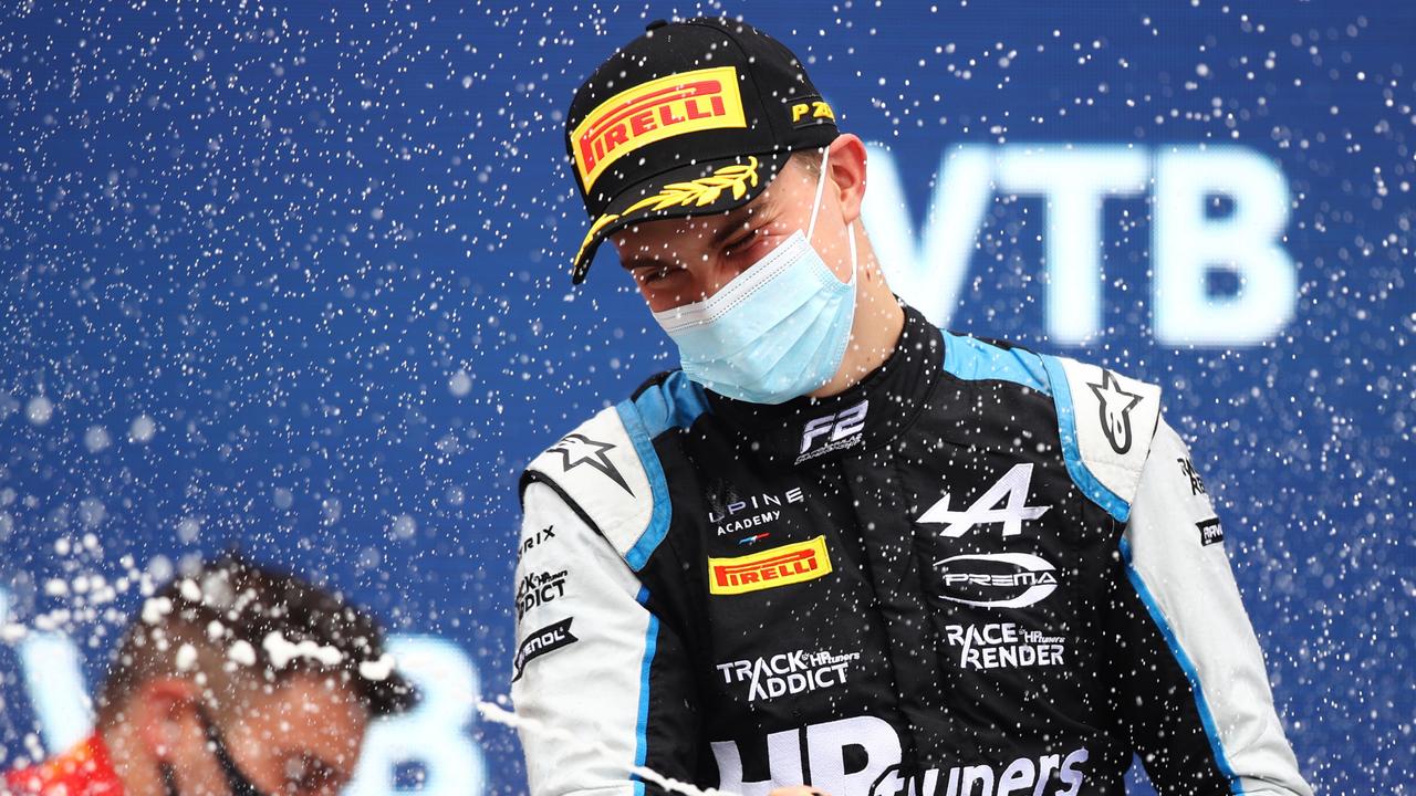 SOCHI, RUSSIA - SEPTEMBER 26: Race winner Oscar Piastri of Australia and Prema Racing celebrates on the podium during the feature race of Round 6:Sochi of the Formula 2 Championship at Sochi Autodrom on September 26, 2021 in Sochi, Russia. (Photo by Joe Portlock - Formula 1/Formula Motorsport Limited via Getty Images)