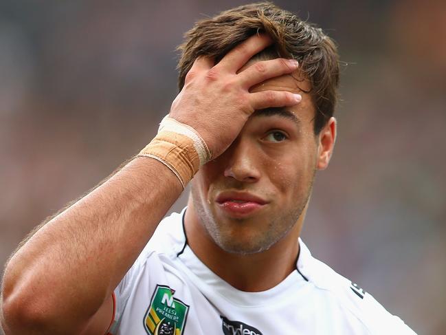 SYDNEY, AUSTRALIA - MARCH 22: Luke Brooks of the Tigers looks dejected after a Rabbitohs try during the round three NRL match between the South Sydney Rabbitohs and the Wests Tigers at ANZ Stadium on March 22, 2015 in Sydney, Australia. (Photo by Mark Kolbe/Getty Images)