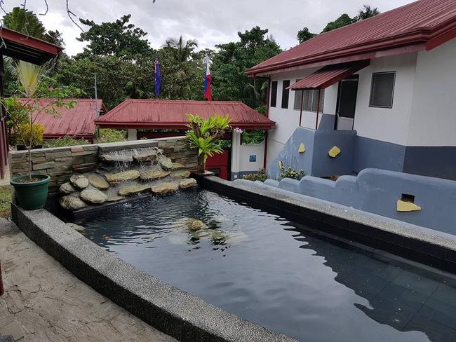 Jason Madden and his new family live in a vast home in Puerto Galera, Philippines which features a koi pond. Picture: Supplied