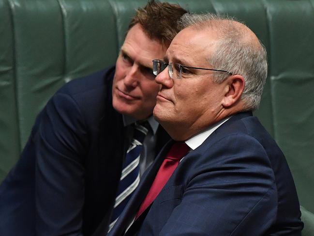 CANBERRA, AUSTRALIA - FEBRUARY 25: Attorney-General Christian Porter and Prime Minister Scott Morrison during Question Time in the House of Representatives at Parliament House on February 25, 2021 in Canberra, Australia. Prime Minister Scott Morrison has lost a working majority in parliament after the Member for Hughes Craig KellyÃ¢â¬â¢s resigned yesterday and moved to the crossbench, warning he is prepared to vote against the government. Mr KellyÃ¢â¬â¢s decision to quit the Liberal Party came after the Prime Minister demanded he stop spreading misinformation about COVID-19 and take action against his office manager, Frank Zumbo, who faces allegations of inappropriate behaviour. (Photo by Sam Mooy/Getty Images)