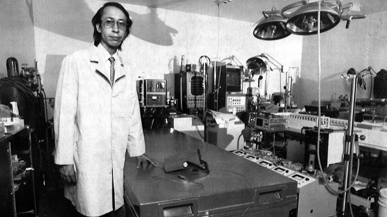 President of US cryogenic company Alcor, Carlos Mondrago, stands beside the box containing the frozen body of Australian Rocco Schiavello in 1990. Picture: Philip Ramey