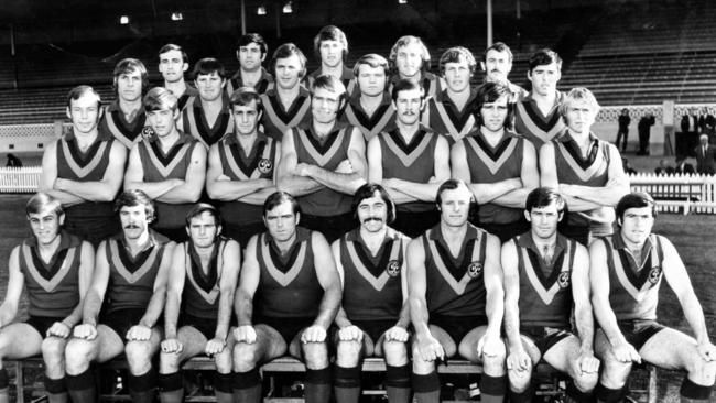 The 1972 South Australian state football team. Front row: Malcolm Blight, Fred Phillis, vice-captain Ray Huppatz, coach Neil Kerley, captain Peter Marker, Phil Nelson, Brian Colbey and Brenton Adcock. Second row: Bob Kingston, Ian Verrier, Barrie Robran, Dean Ottens, Terry Moore, Neil Button and Graham Cornes. Third row: Russell Ebert, Paul Bagshaw, John Wynne, Bob Jaworskyj, Tony Burgan and Peter Woite. Top row: Robin Mulholland, Rodney Pope, Glynn Hewitt, Mark Coombe and Terry von Bertouch.