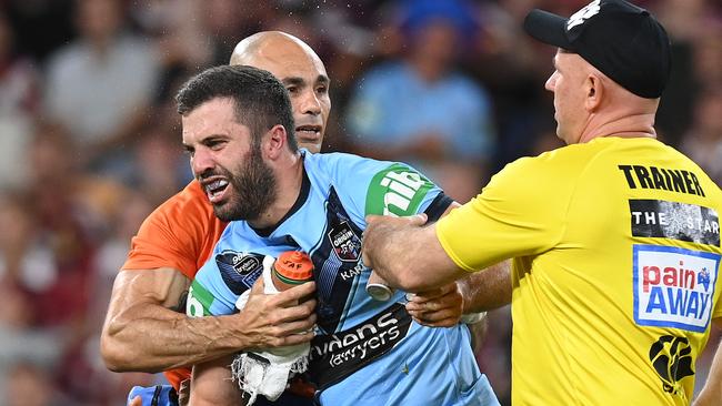 Tedescor was helped after the field after suffering a nasty head knock. Picture: Getty Images.