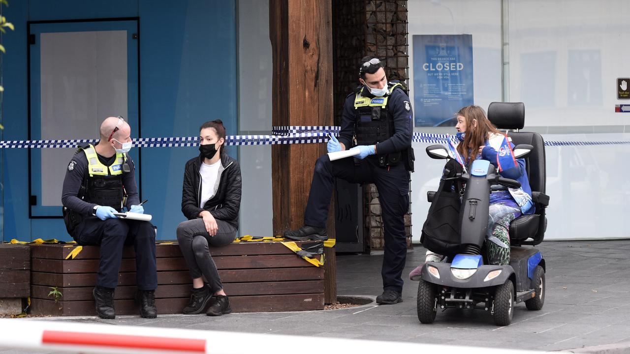 Police speak to witnesses at the scene of the alleged stabbing. Picture: NCA NewsWire / Andrew Henshaw