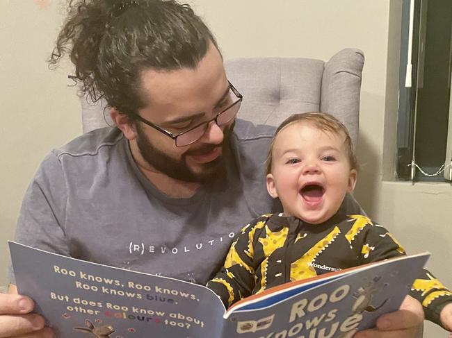 Ibrahim Faraj reading to his daughter Lily. Picture: Supplied