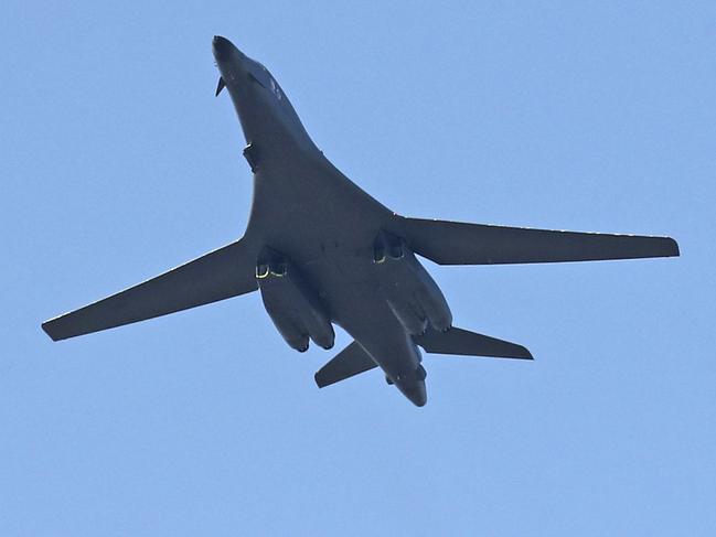 U.S. Air Force B-1B bomber, center, and two South Korean fighter jets F-15K fly over the Seoul Airport where a site for the 2017 Seoul International Aerospace and Defense Exhibition is taking place in Seongnam, South Korea, Saturday, Oct. 21, 2017. U.S. naval commanders on Saturday reiterated Washington's "ironclad" commitment to defend South Korea against North Korean threats as an American nuclear-powered aircraft carrier visited a South Korean port following a joint naval drill. (Kim Do-hun/Yonhap via AP)