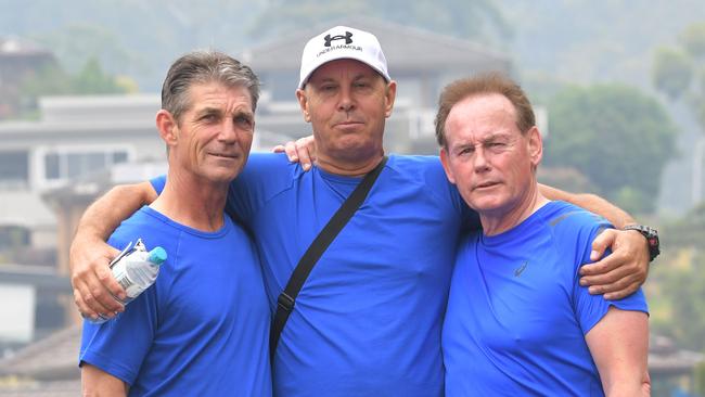 Brothers Paul and Stephen Grimmer and Ricki Nash at the start of a Balgownie to Fairy Meadow walk today to commemorate the 50th anniversary of their sister’s disappearance.