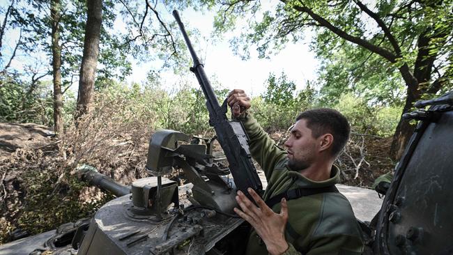 A Ukrainian artilleryman works on a 2S3 Akatsiya self-propelled howitzer in Mykolaiv region amid the Russian invasion of Ukraine. Picture: AFP