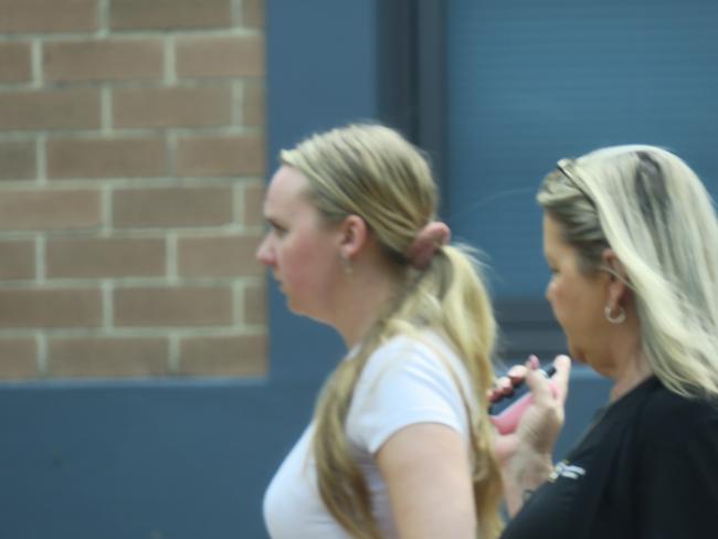 Young nurse Abby Margaret Georgeston (left) leaving Wyong Local Court with a supporter after being sentenced to a community correction order for 18 months over a high range drink-driving crash. Picture: NewsLocal