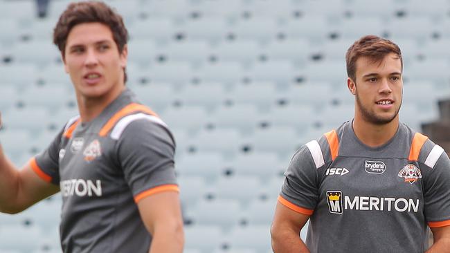 James Tedesco, wearing hat, Luke Brooks, brown/blonde hair, wearing green boots and Mitchell Moses, brown hair, white boots. Wests Tigers training ahead of there game against The Dragons.