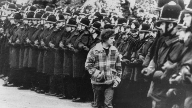 A lone picket “inspects” a line of police at Orgreave Steel Coke Plant in Yorkshire, England.