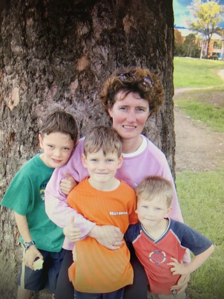 Brisbane AFL footballer Jarrod Berry with mum, Jedda, who died from breast cancer, and brothers Tom (Gold Coast Suns player) and Joel. Picture: supplied