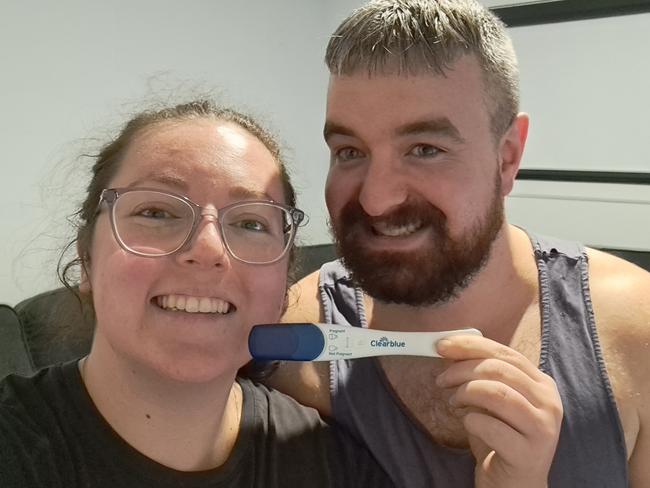 Imogen and Michael with positive pregnancy test.