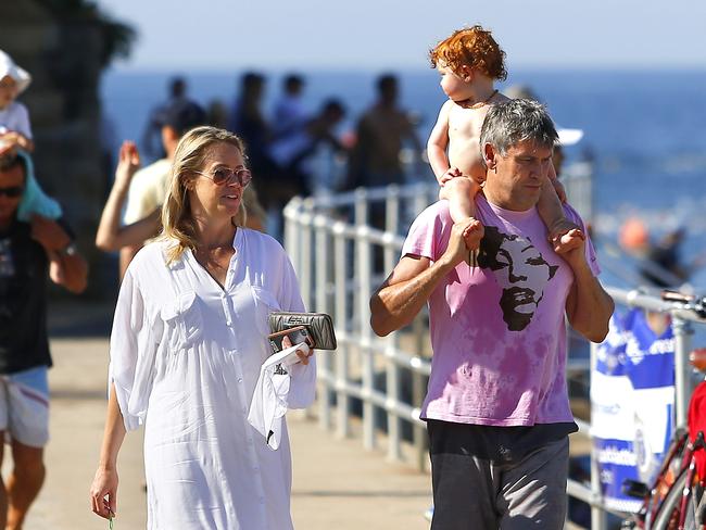 Leila McKinnon and David Gyngell with son, Edmund at Bondi Beach. Picture: Bradley Hunter