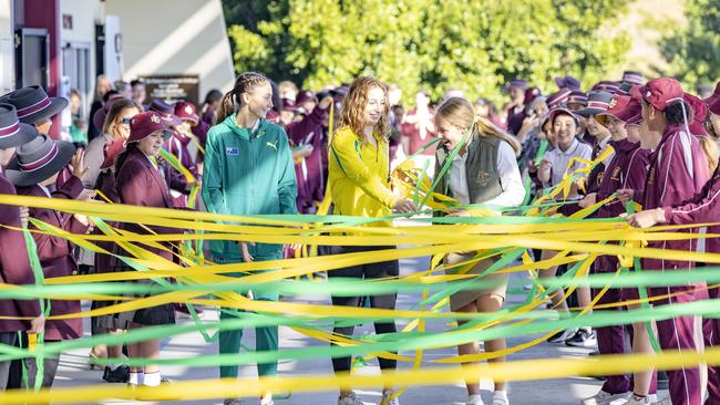 Students welcome Commonwealth Games swimmer Mollie O'Callaghan (middle) and Toby Stolberg and Ella Ramsay at St Peters, Springfield, Monday, August 15, 2022 - Picture: Richard Walker