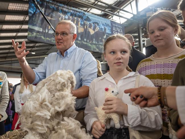 Scott Morrison with his daughters Abbey and Lily at the Sydney Royal Easter Show on Saturday. Picture: Jason Edwards