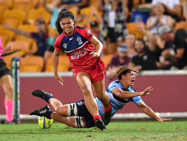 Queensland Reds player Alysia lefau-Fakaosilea scores the winning try to win the womens final against the New South Wales Waratahs at the Brisbane Global Rugby Tens at Suncorp Stadium in Brisbane, Saturday, February 10, 2018. ( AAP Image/Darren England) NO ARCHIVING, EDITORIAL USE ONLY