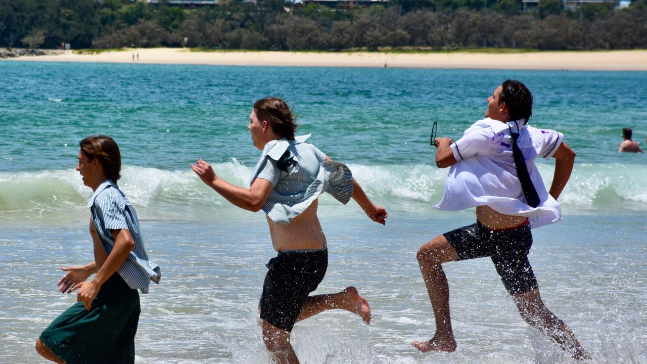 Year 12 graduates from schools across the Sunshine Coast hit to the water at Mooloolaba Beach to celebrate the end of their schooling. Photo: Mark Furler