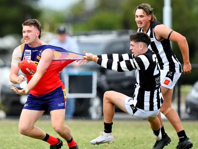 Mitchell Day of Diggers Rest is tackled by Owen Fowler of Wallan during the round two RDFNL Bendigo Bank Seniors match between Diggers Rest and Wallan at Diggers Rest Recreation Reserve, on April 13,2024, in Diggers Rest, Australia. (Photo by Josh Chadwick)