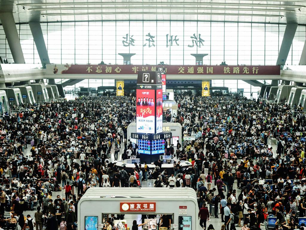 Passengers wait for trains at Hangzhou East train station, in China’s eastern Zhejiang province, on September 30. Picture: STR/AFP