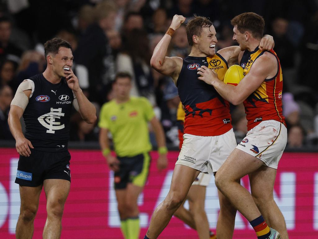 Adelaide skipper Jordan Dawson and Mark Keane celebrate on the final siren. Picture: Michael Klein