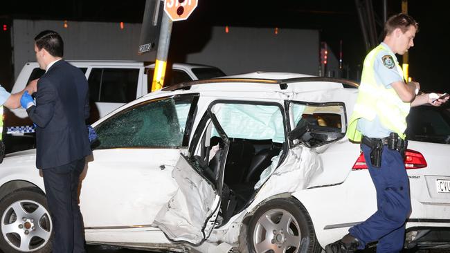 Police at the scene of the accident on Woodville Road. Picture: Bill Hearne