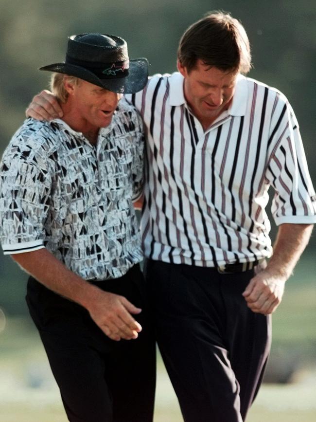 Greg Norman and Nick Faldo walk off the 18th hole in 1996 Picture: AP