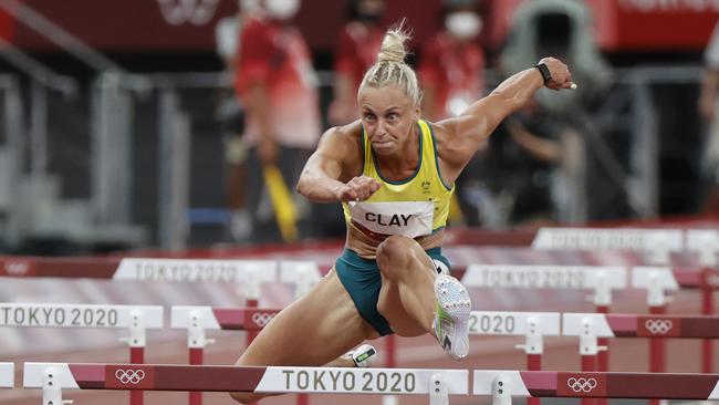 Liz Clay finishes third the semi-final of the Womens 100m Hurdles — after three restarts. Picture: Alex Coppel. .