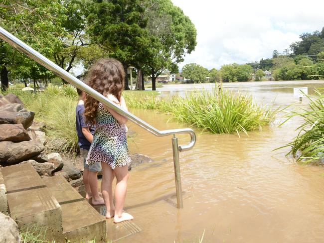 Emily and Mason Randles assess the flooding at Budd Park on the Tweed Rivers in Murwillumbah on Tuesday, December 15, 2020. Picture: Liana Boss