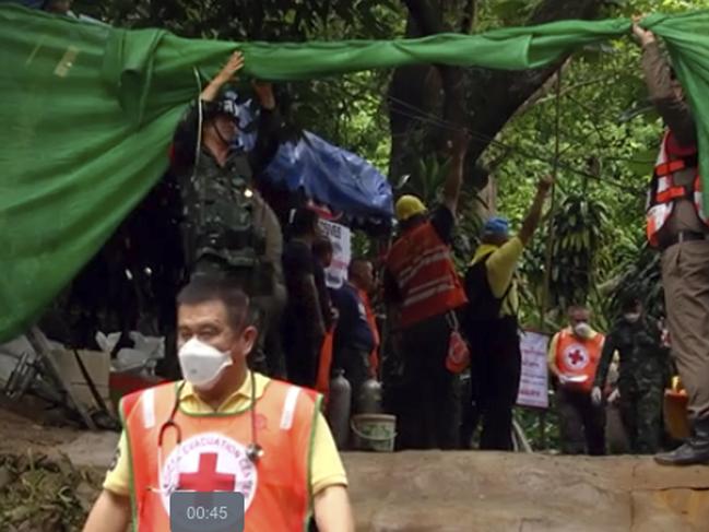 Emergency workers carry a stretcher with one of the rescued boys to be transported by ambulance to a hospital, in Mae Sai. Picture: AP