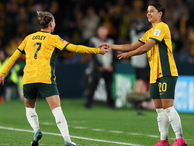 Steph Catley (left) hands Sam Kerr the captain’s armband. Picture: Cameron Spencer/Getty Images