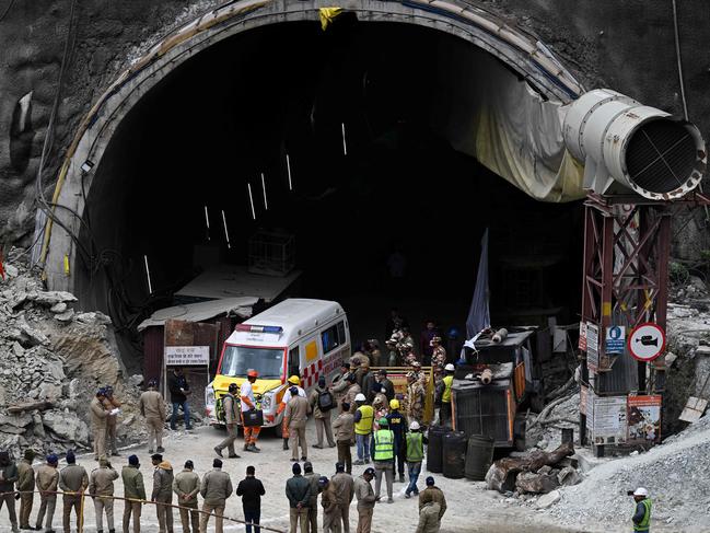 An ambulance and rescue operatives gather near the face of the collapsed under construction Silkyara tunnel in the Uttarkashi district of India's Uttarakhand state. Picture: AFP