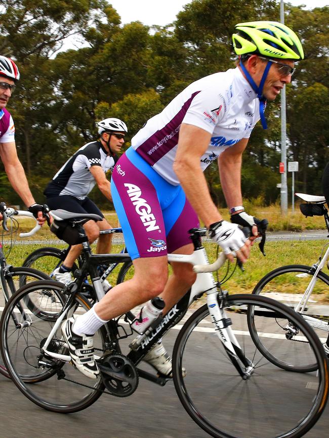 Former Prime Minister Tony Abbott cycling at Akuna Bay after winning the 2013 election. Picture: Bradley Hunter