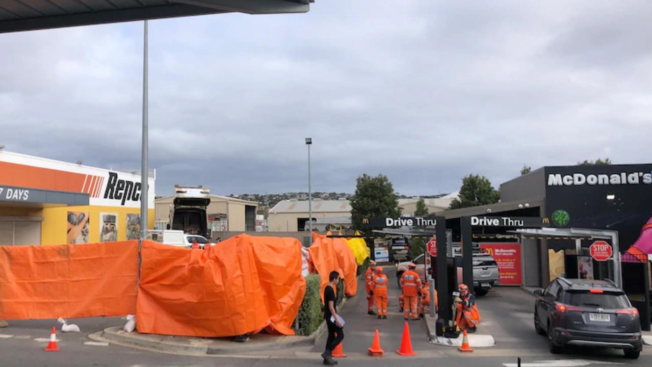 Emergency services were called to the Repco carpark next to the drive-through of a McDonald's outlet on Liverpool Street just after 5.20am. Picture: ABC News/Evelyn Leckie