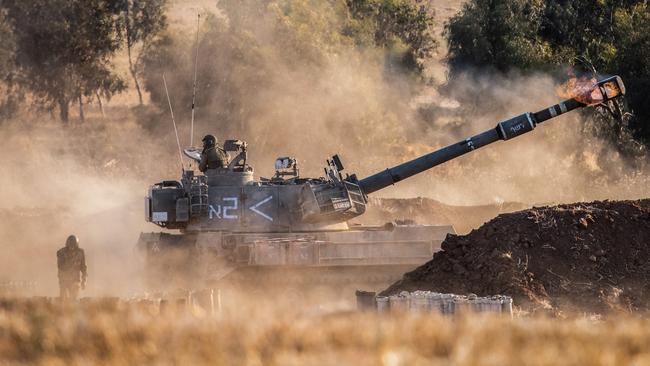 A self-propelled howitzer fires across the border from near Sderot. Picture: Reuters