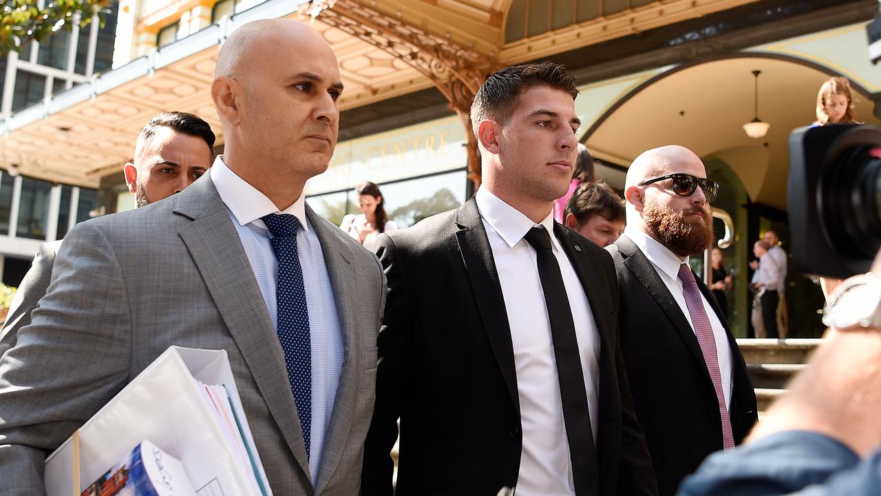Lawyer Danny Eid (left) and NRL player Curtis Scott (centre) leave the Downing Centre Local Court in Sydney