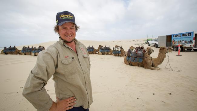 Luke Parrott of Oakfield Ranch Camels, at Birubu Beach, Port Stephens, NSW. Picture: Liam Driver