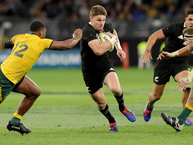 Beauden Barrett (centre) is the highest paid All Black.