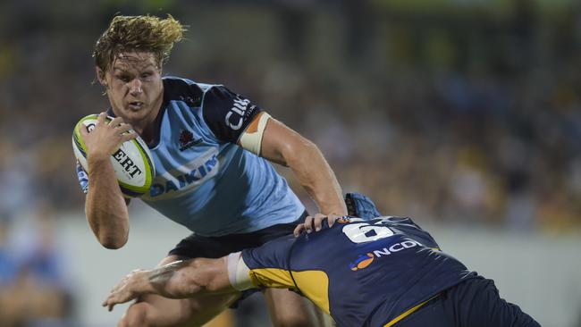 Michael Hooper of the Waratahs is tackled at GIO Stadium in Canberra.