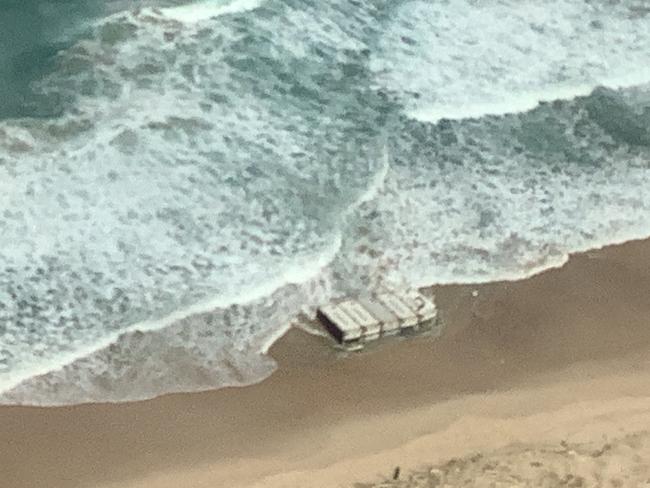 Aerial images of shipping containers washed up on Birdie Beach. Supplied: Transport for NSW