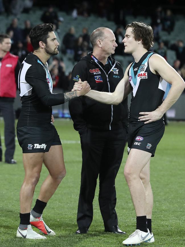 Chad Wingard with Jared Polec and Ken Hinkley after the loss to Essendon on Friday night. Picture Sarah Reed