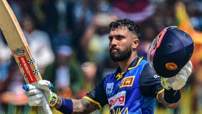 Sri Lanka's Kusal Mendis celebrates after scoring a century (100 runs) during the second and last one-day international (ODI) cricket match between Sri Lanka and Australia at the R. Premadasa International Cricket Stadium in Colombo on February 14, 2025. (Photo by Ishara S. KODIKARA / AFP)