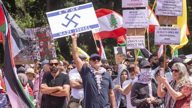 Al Yazbek holding a flag at a Sydney rally on Sunday. Picture: Jeremy Piper