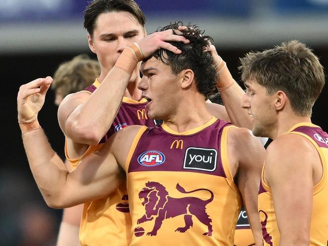 GOLD COAST, AUSTRALIA - JULY 27: Cam Rayner of the Lions celebrates kicking a goal during the round 20 AFL match between Gold Coast Suns and Brisbane Lions at People First Stadium, on July 27, 2024, in Gold Coast, Australia. (Photo by Matt Roberts/AFL Photos/via Getty Images)